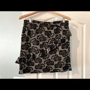 Anthropologie mini skirt with ruffle! Like new!